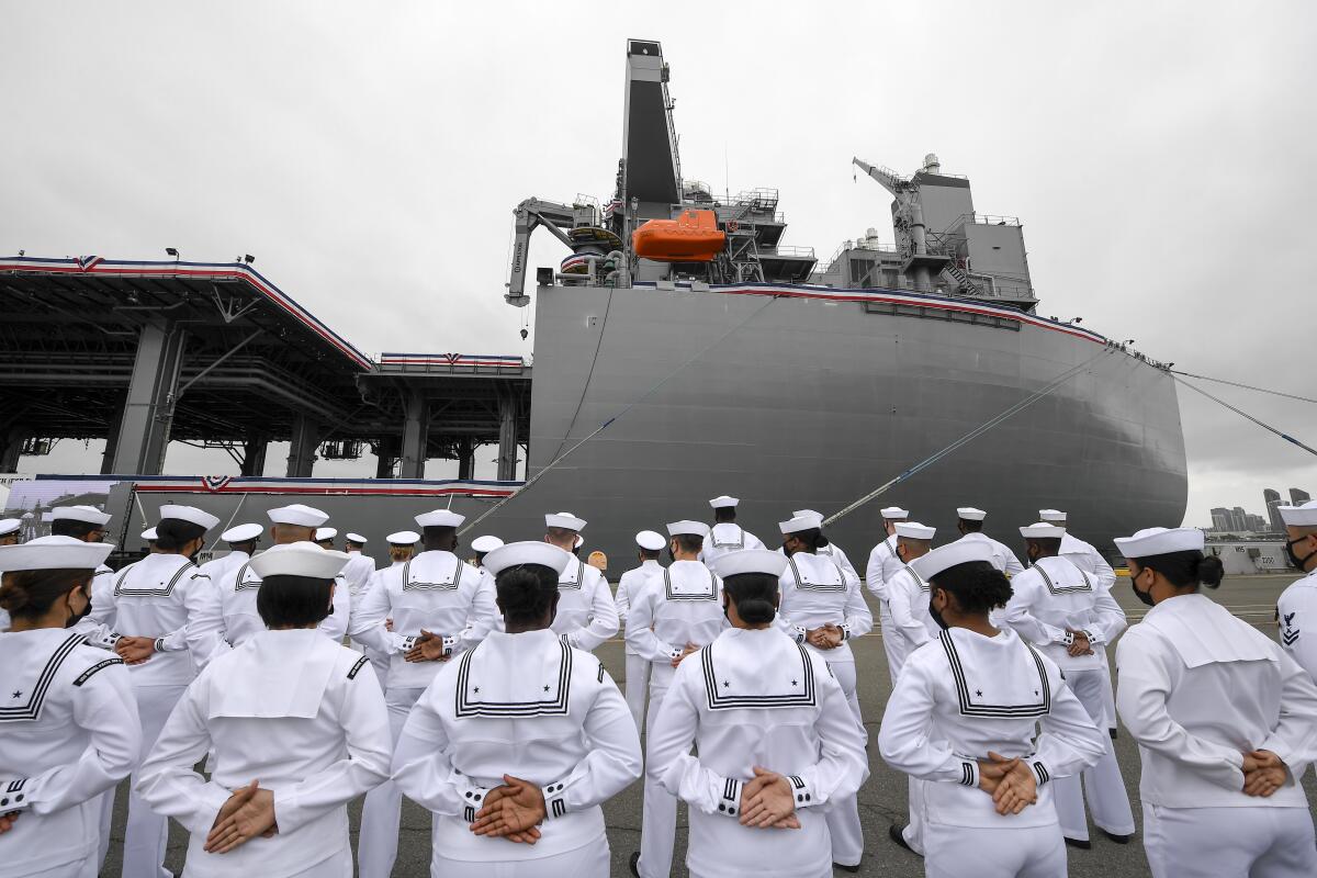 U.S. Navy sailors stand at attention during a commissioning ceremony