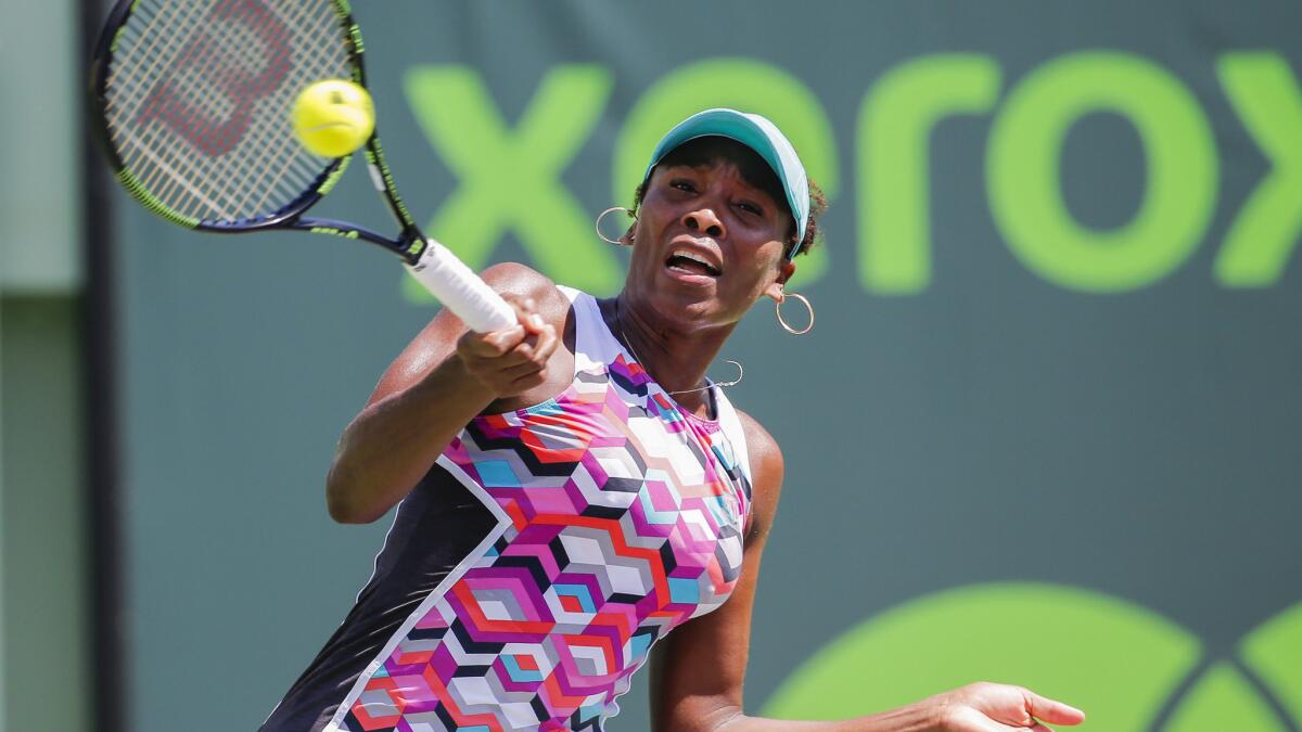 Venus Williams returns a shot during her victory over Caroline Wozniacki in the Miami Open quarterfinals on Monday.