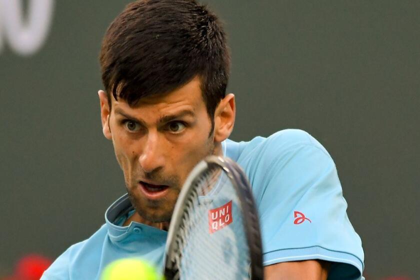 Novak Djokovic hits to Kyle Edmund at the BNP Paribas Open on Sunday.