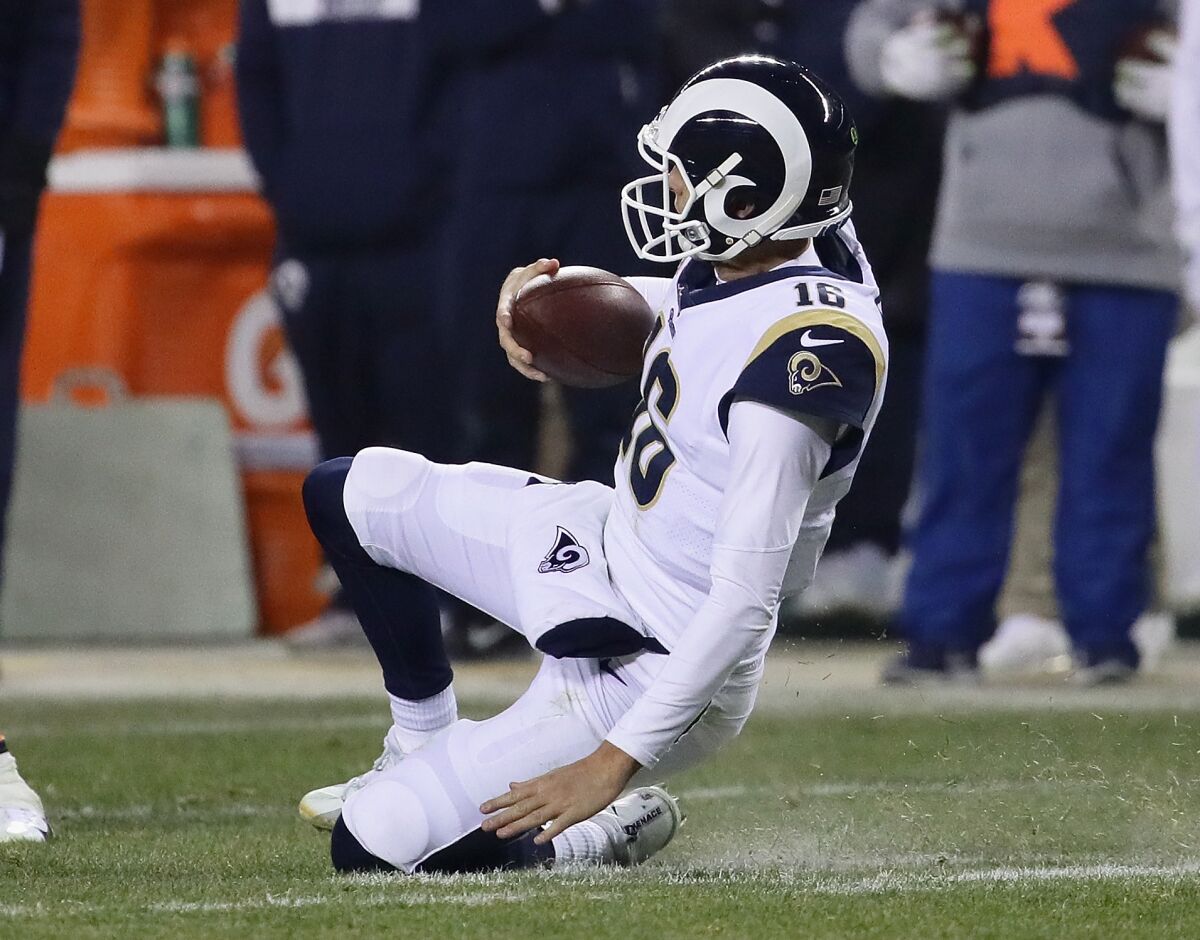 Rams quarterback Jared Goff slides before being tackled by the Chicago Bears in a 2018 game at Soldier Field.