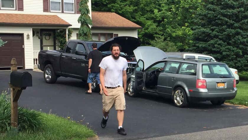 Michael Rotondo, 30, prepares to leave his parents' house in Camillus, N.Y., on Friday. Rotondo, whose eviction from his parents' home drew national attention, finally left hours before a court-ordered deadline.