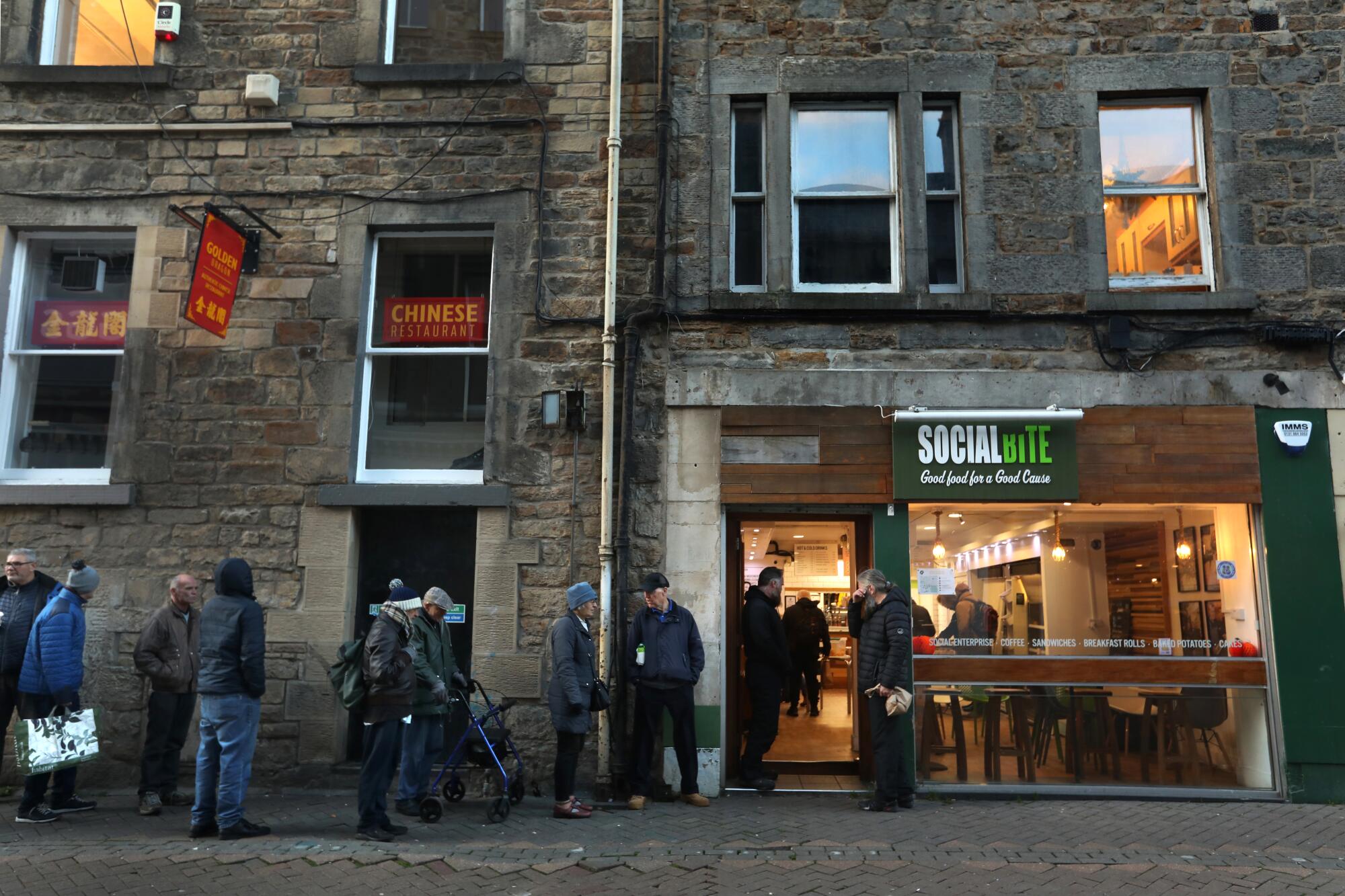 People line up at Social Bite, which provided breakfast for anyone who is in need in downtown Edinburgh