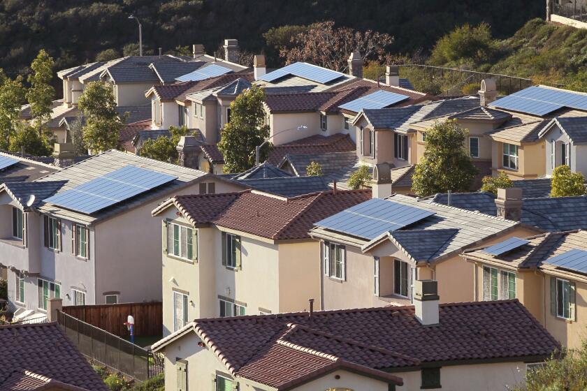 Many houses in this section of the San Elijo Hills area of San Marcos have solar panels of their roofs.