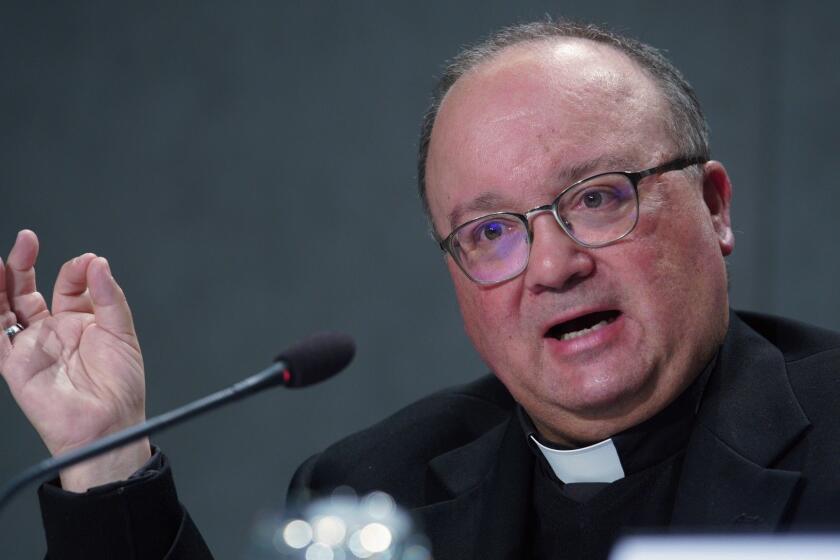 Malta's Archbishop Charles Scicluna talks to journalists during a press conference to present the new sex abuse law, at the Vatican's press room, Rome, Thursday, May 9, 2019. Pope Francis issued a groundbreaking law Thursday requiring all Catholic priests and nuns around the world to report clergy sexual abuse and cover-up by their superiors to church authorities, in an important new effort to hold the Catholic hierarchy accountable for failing to protect their flocks. (AP Photo/Andrew Medichini)