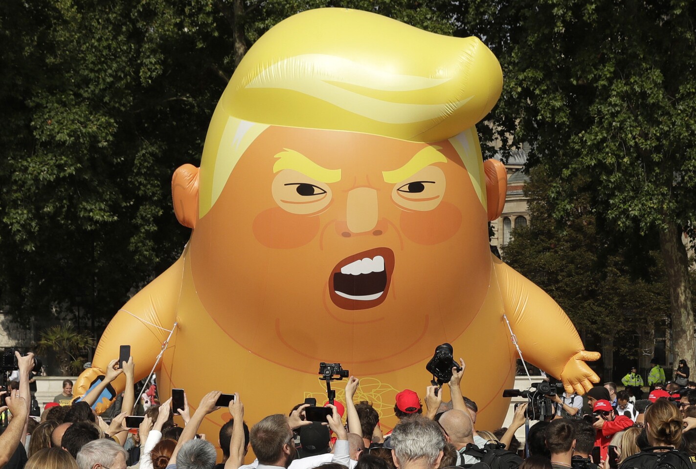 A 20-foot cartoon baby blimp of U.S. President Donald Trump is flown in Parliament Square in London as a protest against his U.K. visit. Trump is making his first trip to Britain as president after a tense summit with NATO leaders in Brussels.