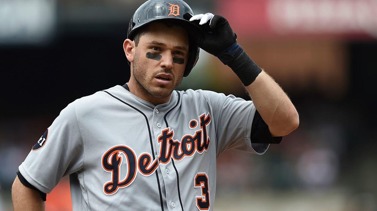 The Tigers' Ian Kinsler removes his batting helmet after popping out with two on against the Baltimore Orioles in the fourth inning of a baseball game, Sunday, Aug. 6, 2017, in Baltimore. The Orioles won 12-3.