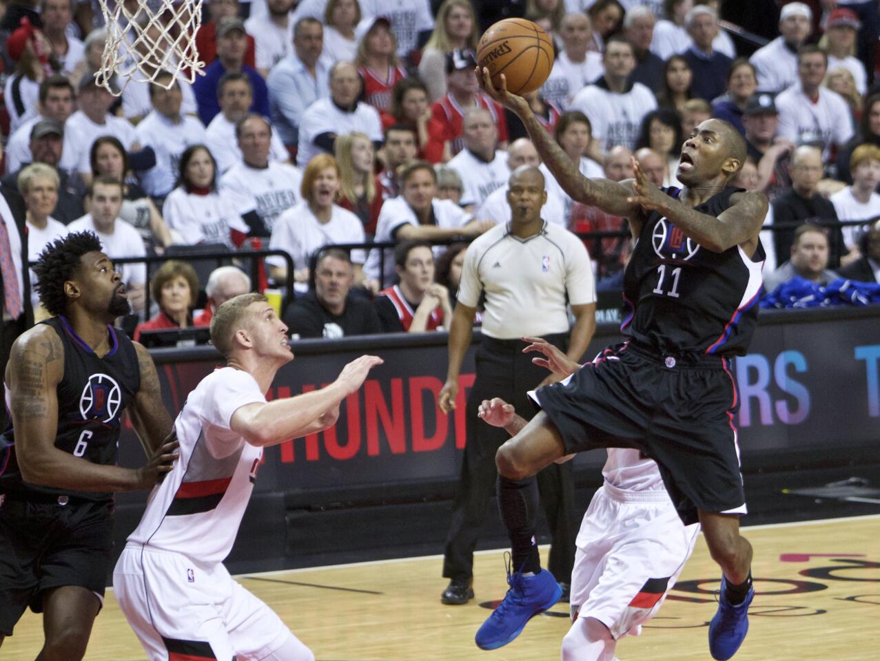 Clippers guard Jamal Crawford drives to the basket for a layup over Trail Blazers center Mason Plumlee during the second half of Game 6.