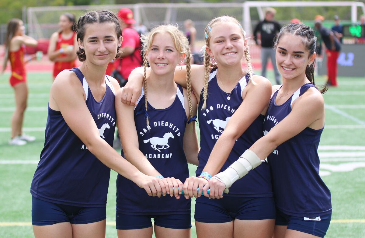 The Mustangs' 4x100 relay quartet post-race (l - r): Carly Renison, Mia Pullman, McKenna Howard, Cassandra Cinzori)