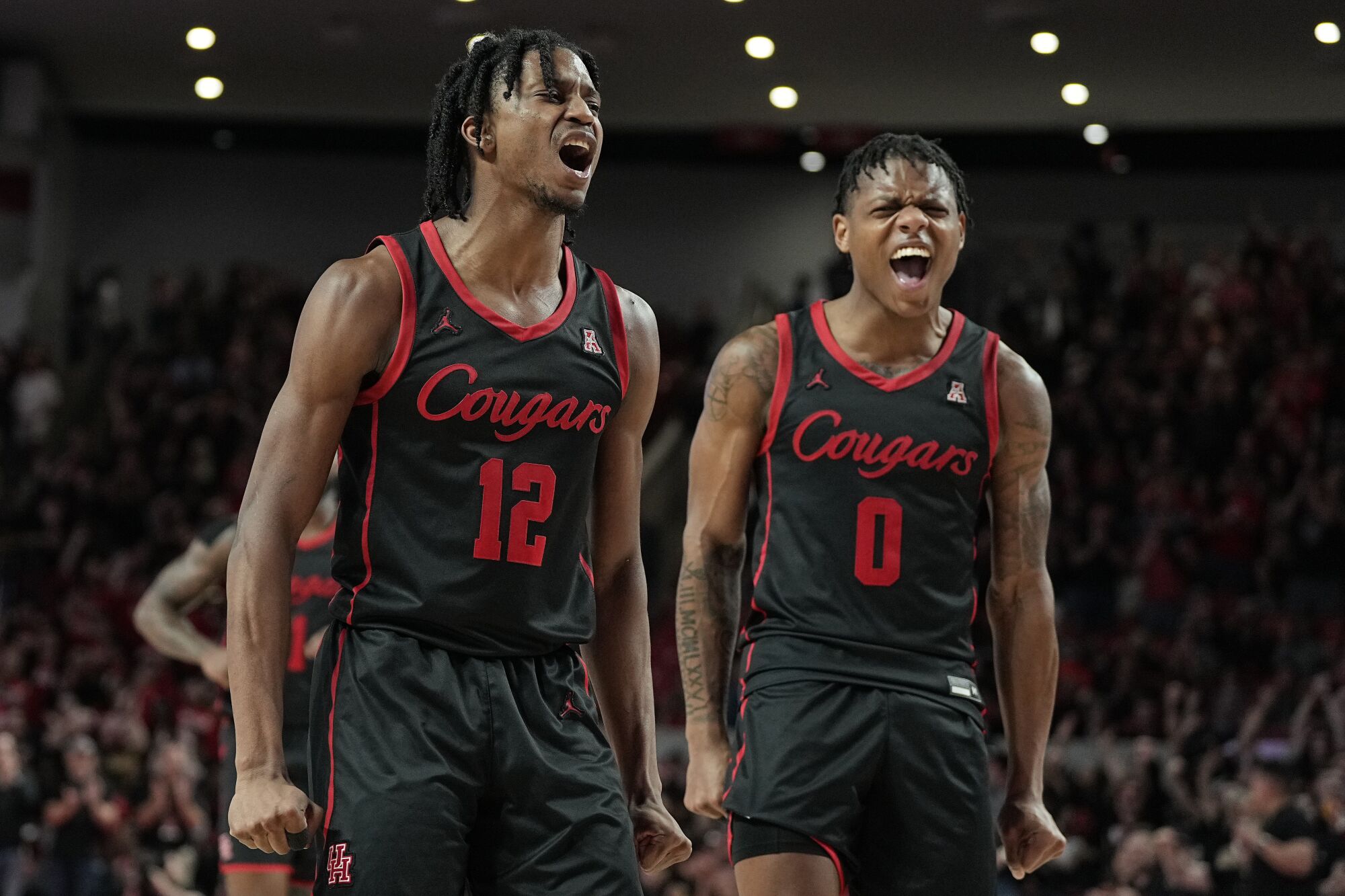 Tramon Mark and Marcus Sasser cheer during a Houston game.