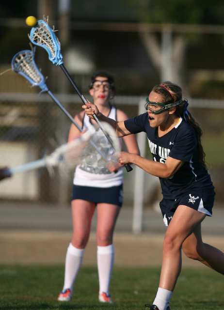 Newport Harbor's Stephanie Storch shoots against Corona del Mar during the Battle of the Bay lacrosse match at Newport Harbor High School on Friday.