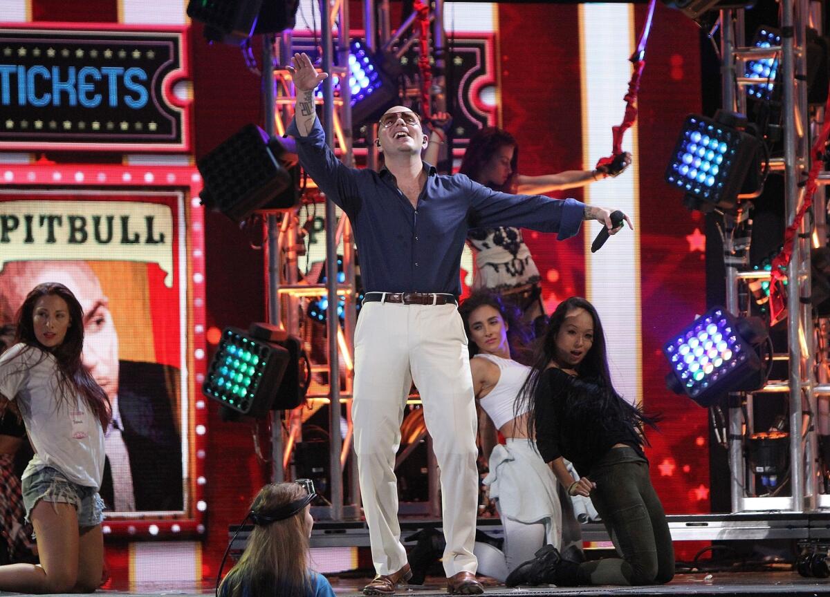Pitbull rehearses for the 2014 Premios Juventud awards show at Miami's BankUnited Center on July 16.