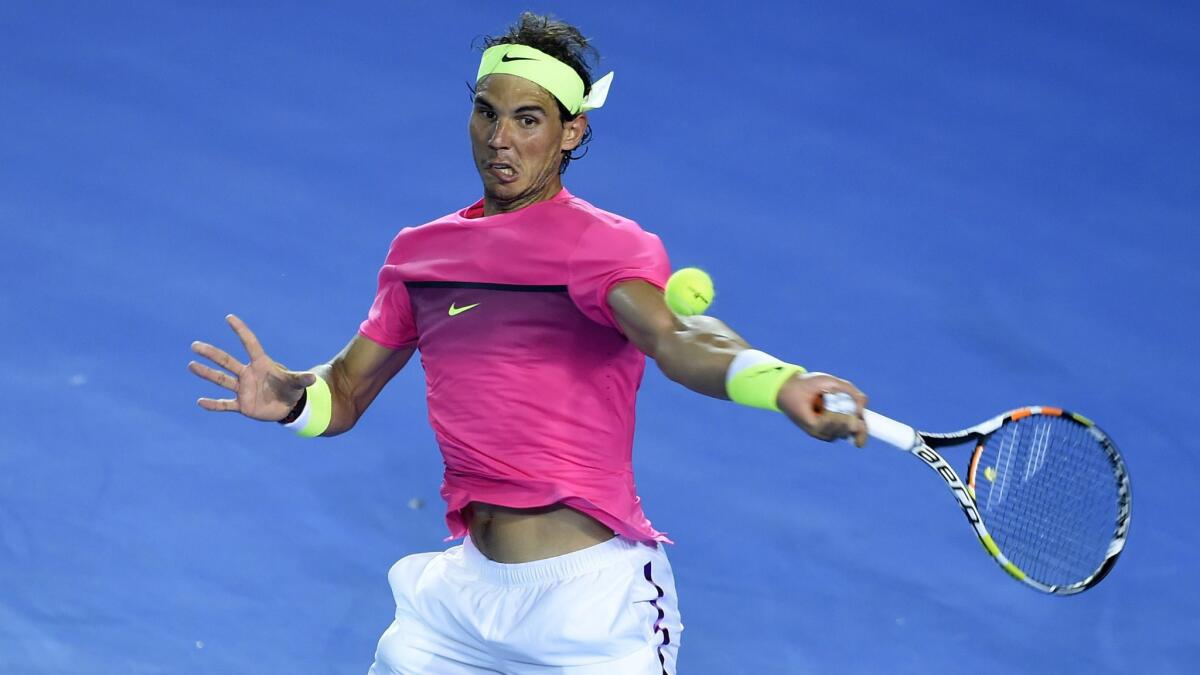 Rafael Nadal returns a shot during his victory over American qualifier Tim Smyczek in the second round of the Australian Open on Wednesday.