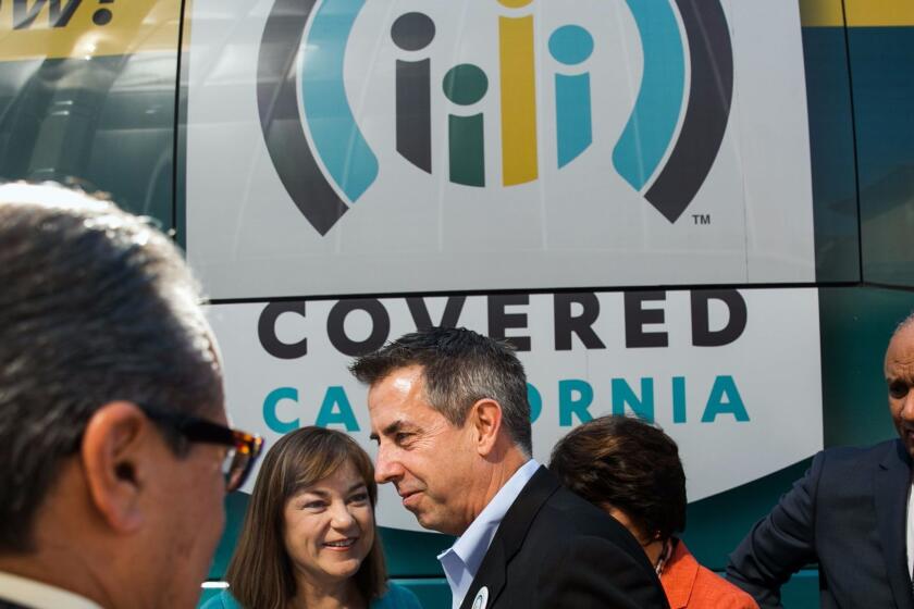 LOS ANGELES, CALIF. -- SUNDAY, NOVEMBER 1, 2015: Covered California executive director Peter V. Lee, center, mingle with fellow lawmakers after a press conference to announce the first day of this yearâs open-enrollment period and encourage more Californians to enroll for healthcare, at the AltaMed Medical Groupâs Boyle Heights office, in Los Angeles, Calif., on Nov. 1, 2015. (Marcus Yam / Los Angeles Times)