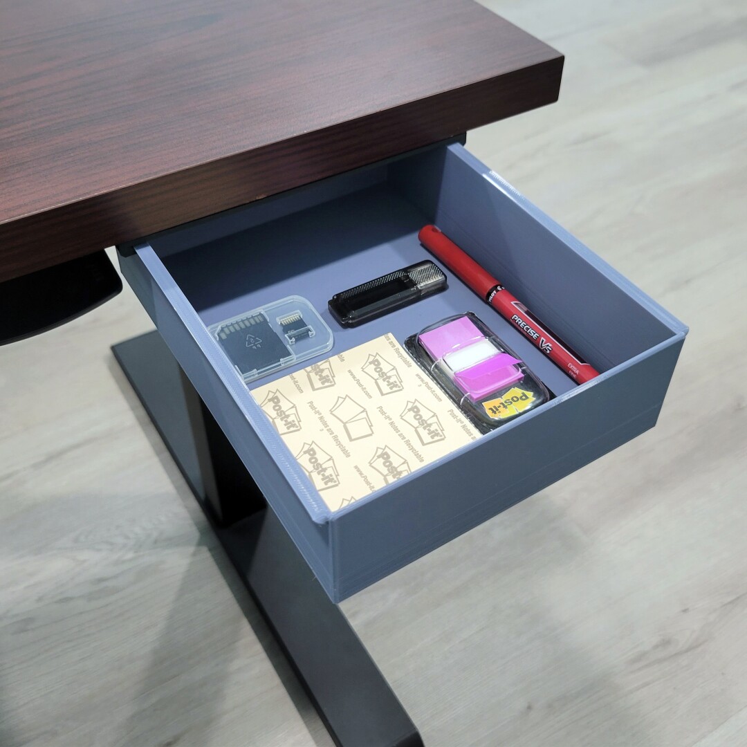 An open desk drawer