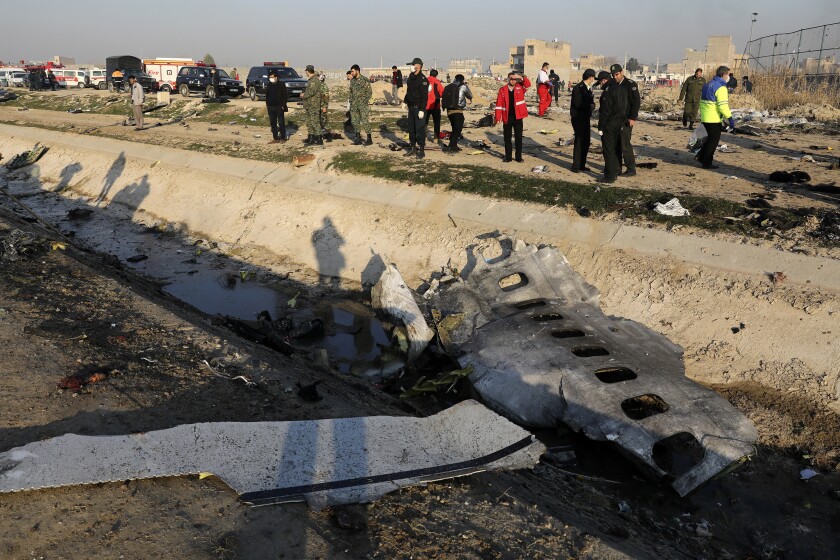 Authorities work Jan. 8 at the scene of the Ukrainian jet crash in Shahedshahr, Iran, southwest of Tehran. 