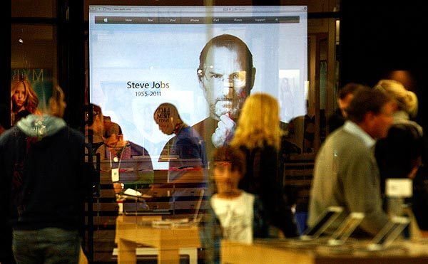 An image of Steve Jobs is projected inside the Apple Store in Santa Monica.