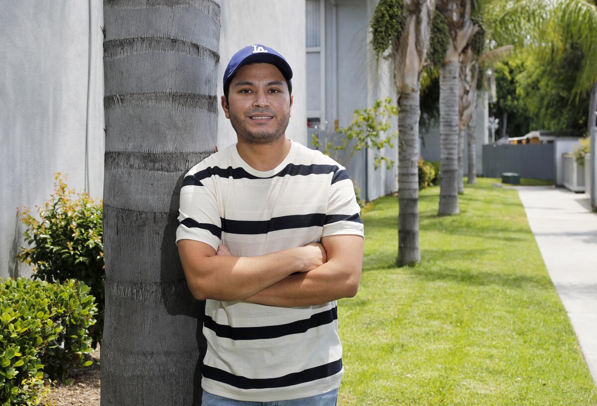 Cal State Fullerton student Oscar Flores, 29, of Anaheim is a public relations major who is entering into the job market after he graduates this spring. Flores is currently taking four virtual classes. Due to the coronavirus, he was laid off from an internship at a company that was going to extend his time until he got a job.