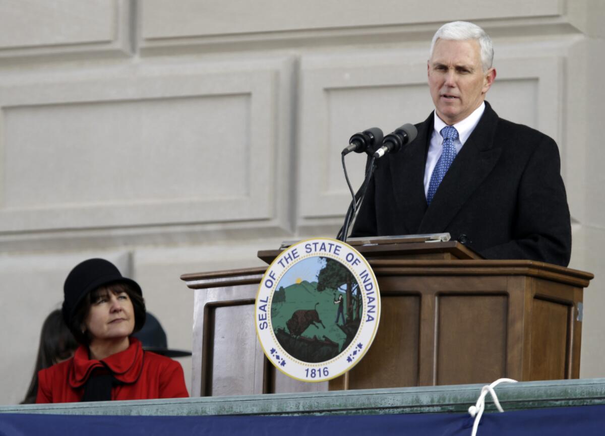 Indiana Gov. Mike Pence, seen here at his 2013 inauguration, courted conservative activists Friday at a summit in Dallas.