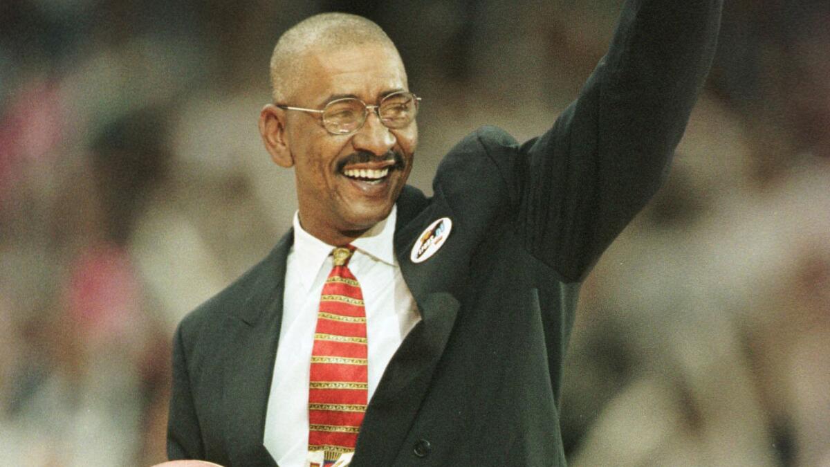 Former San Antonio Spurs and ABA star George Gervin acknowledges the crowd before Game 1 of the 1999 NBA Finals between the Spurs and New York Knicks at the Alamodome in San Antonio, Texas.