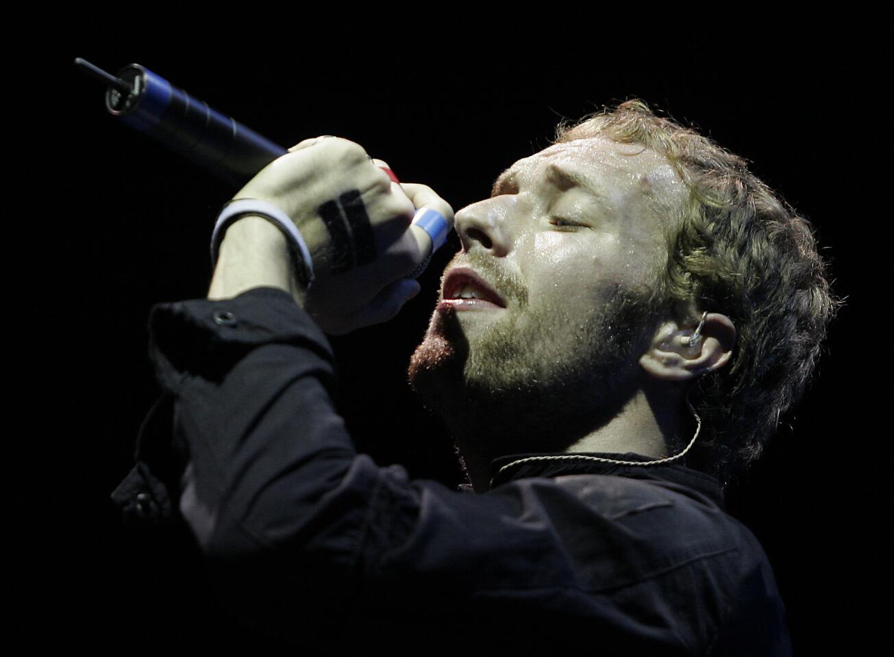 Singer Chris Martin of Coldplay performs during the Coachella Valley Music and Arts Festival, 2005.