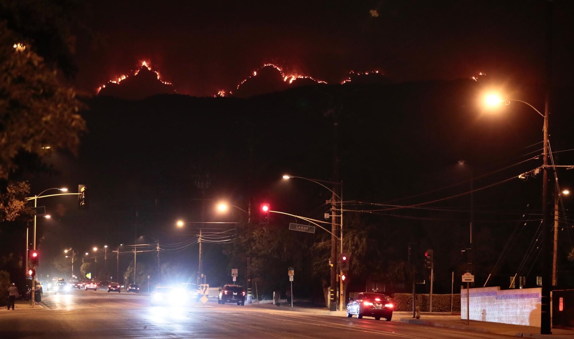 The Bobcat fire smolders in the mountains above Monrovia.