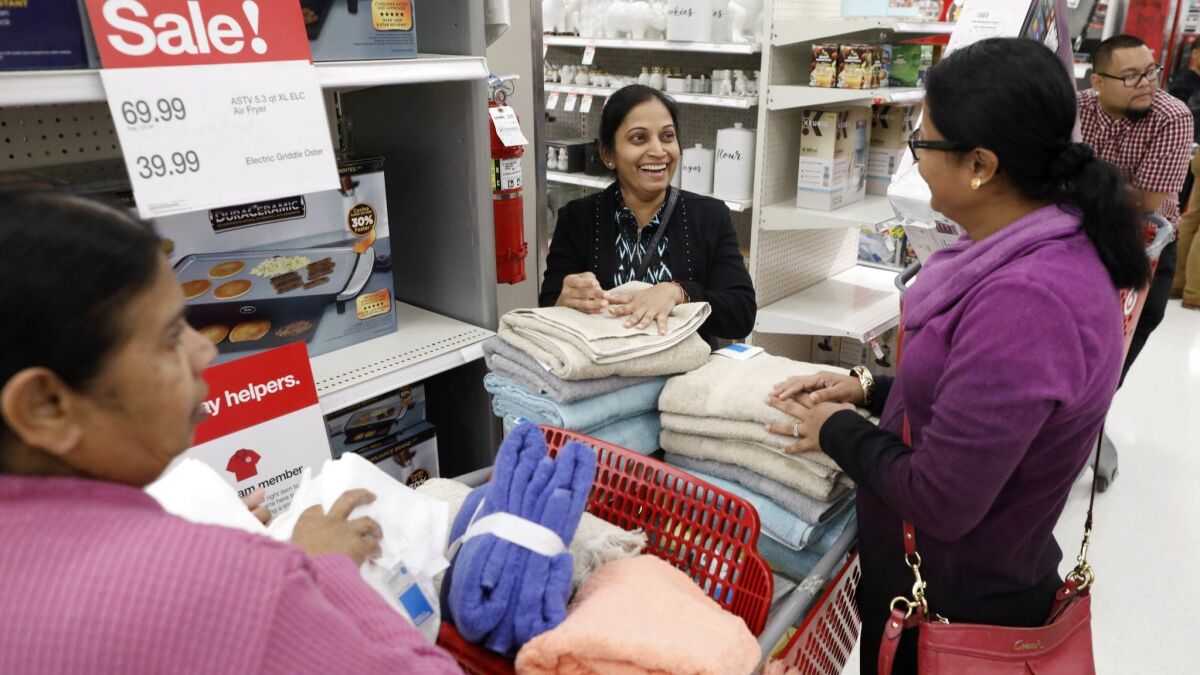 Muniamma Chand, left, with daughters Romi Chand, and Monecta Chand, of Carson, shop for Black Friday deals on Thanksgiving Day at Target in Carson's SouthBay Pavilion.