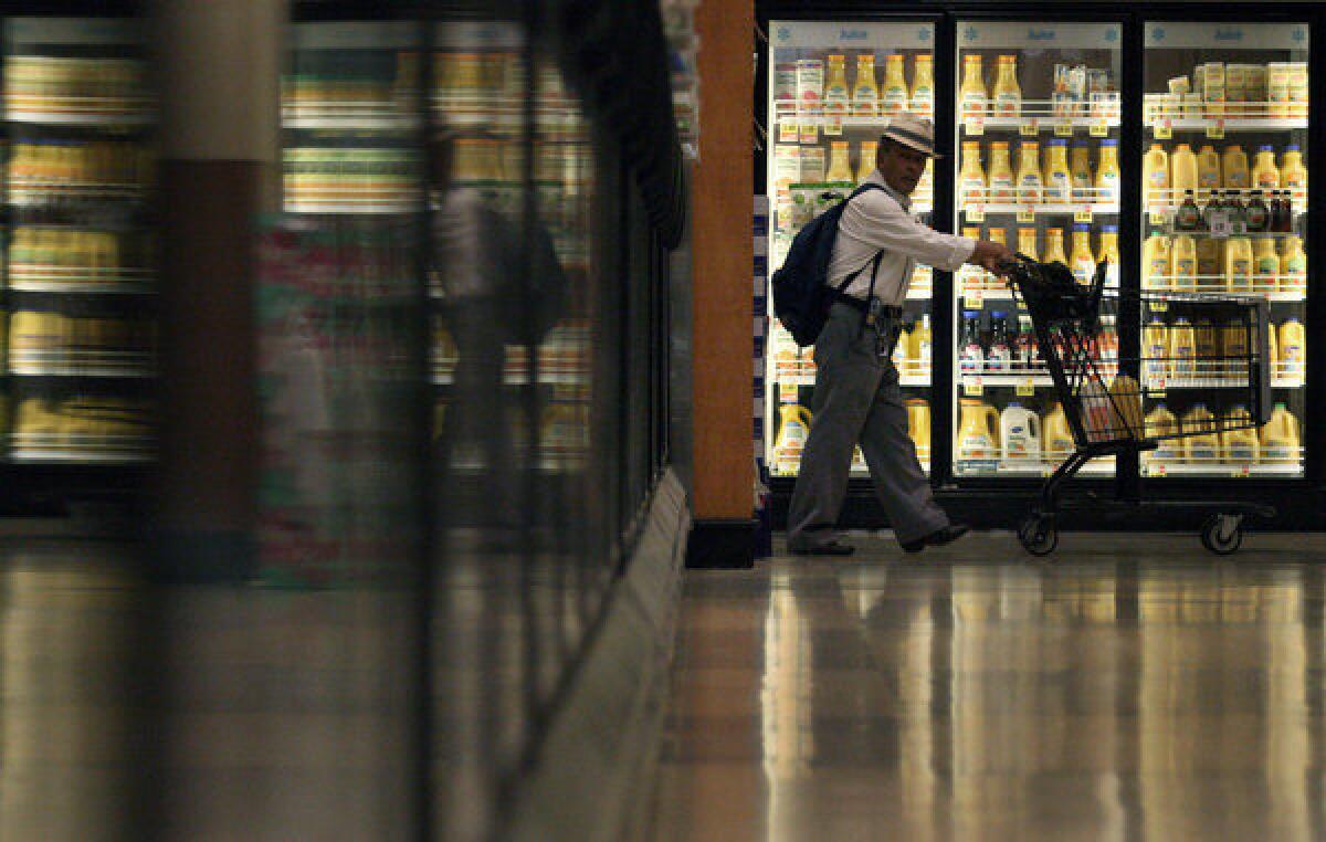 Shopper Atanacio Mandujano scans each aisle while shopping at Ralph's in Los Angeles on August 30, 2013.