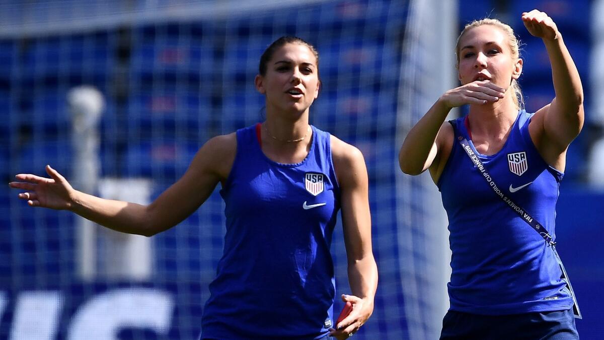 U.S. forward Alex Morgan, left, and midfielder Allie Long take part in a training session Sunday.