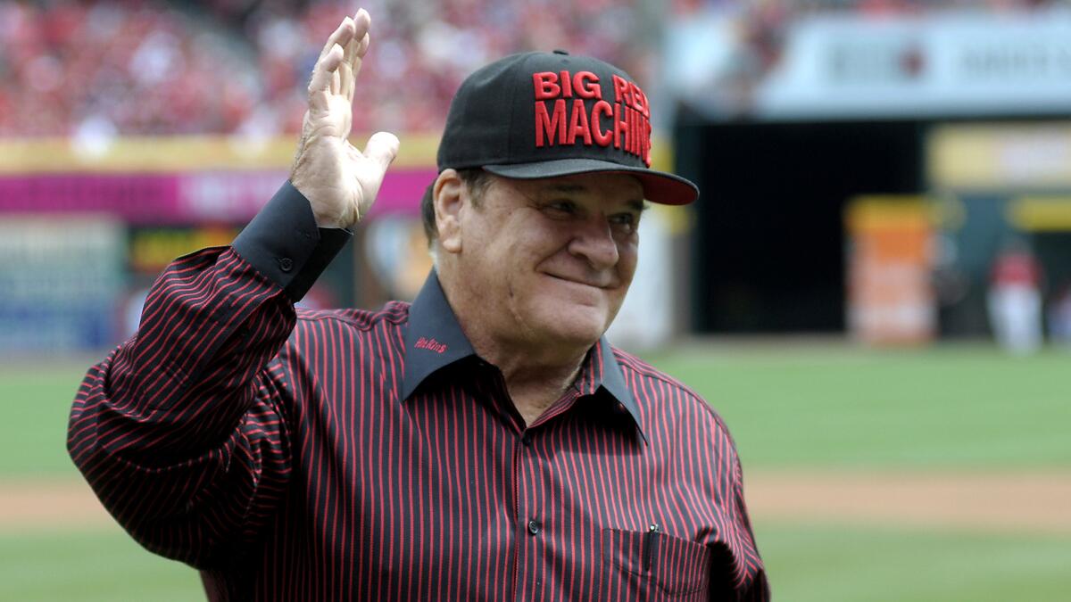 Pete Rose acknowledges the fans during a ceremony at Great American Ball Park in Cincinnati on Sept. 12.