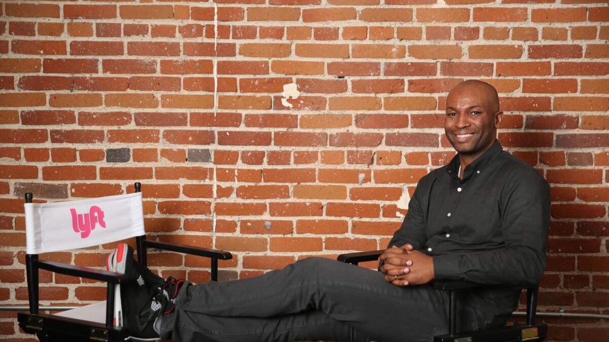 Allen Narcisse, Lyft’s Southern California regional director, sits for a portrait at the ride-hailing company’s downtown Los Angeles hub.