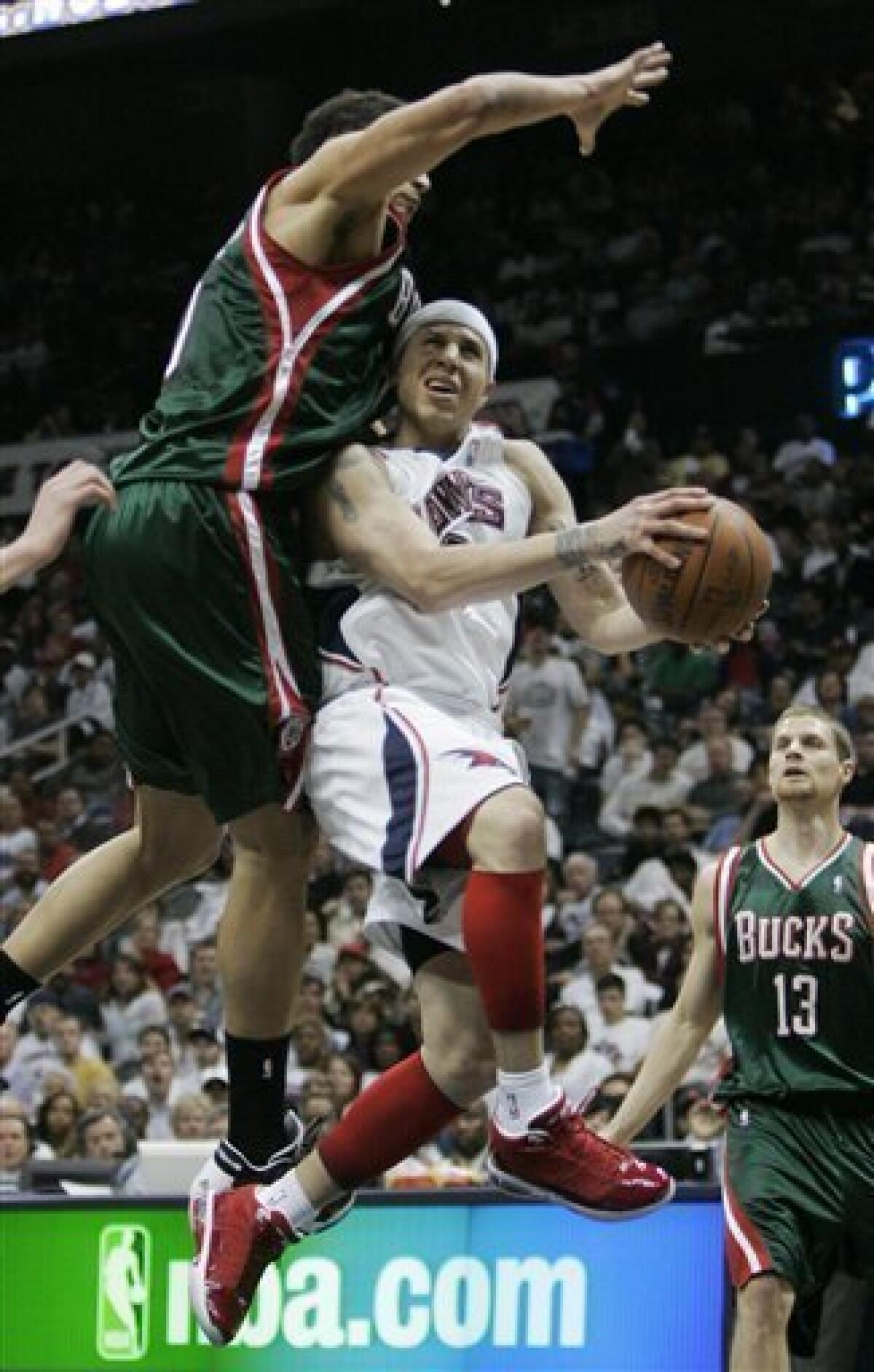 Mookie Blaylock of the Atlanta Hawks loses control of the ball as