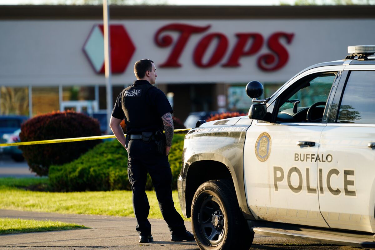 Police officer outside scene of mass shooting in Buffalo, N.Y.