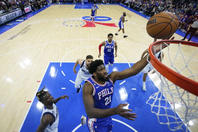 Philadelphia 76ers' Joel Embiid goes up for a shot during the first half of an NBA basketball game against the Dallas Mavericks, Wednesday, March 29, 2023, in Philadelphia. (AP Photo/Matt Slocum)