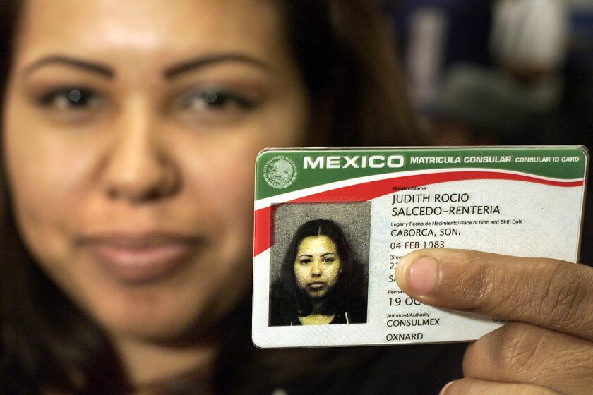 Mel Melcon   Judith Rocio SalcedoRenteria, 19, from Santa Maria, holds her newly issued Matricula Consular ID.