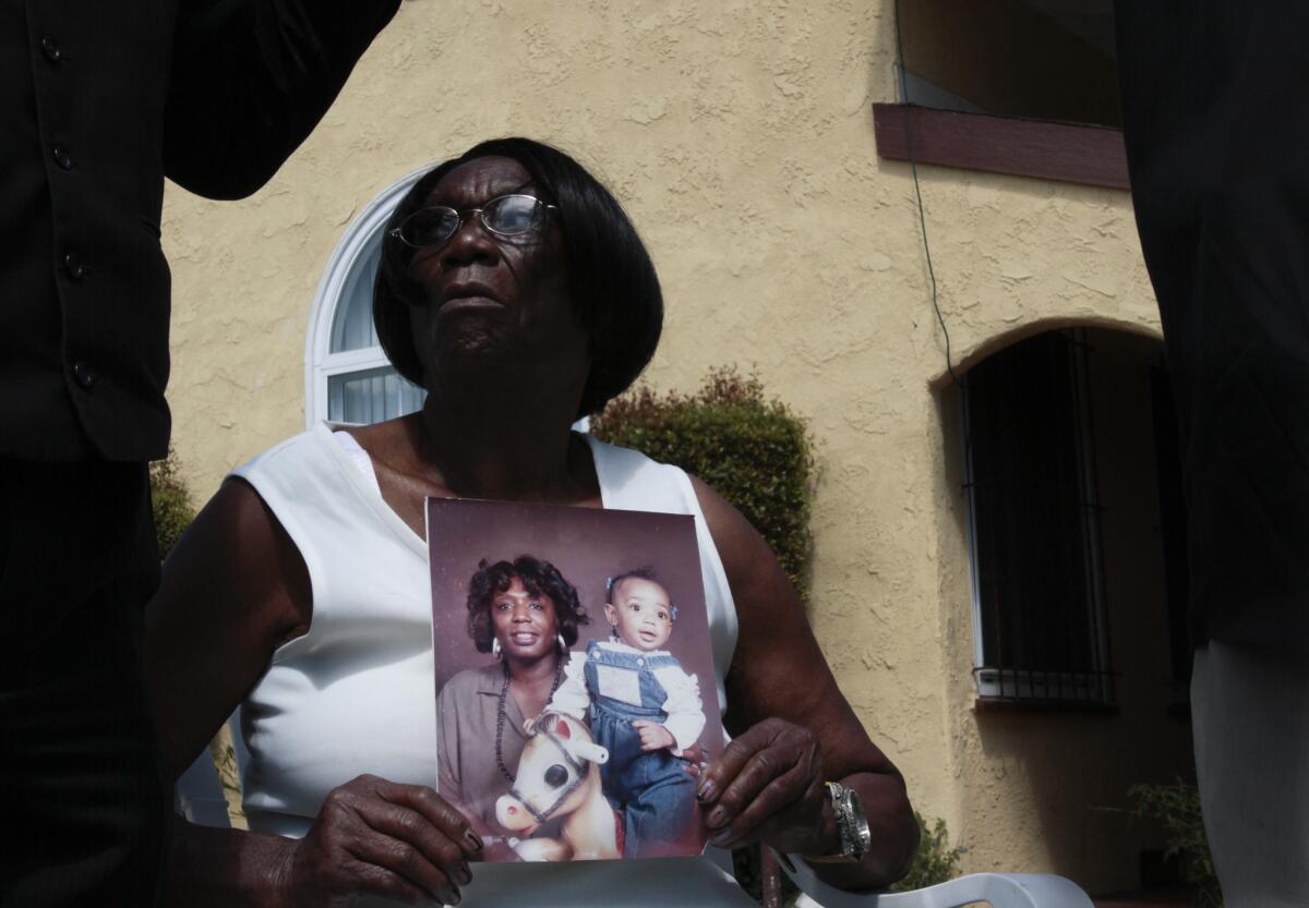 Ada Moses holds a photo of her granddaughter, Alesia Thomas, as she speaks during a 2012 news conference. Thomas died soon after an altercation with a Los Angeles Police Department officer.