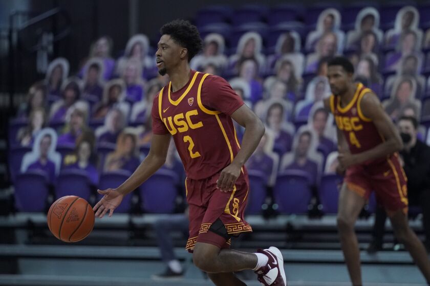 Southern California guard Tahj Eaddy (2) in action against Washington during an NCAA college basketball game, Thursday, Feb. 11, 2021, in Seattle. (AP Photo/Ted S. Warren)