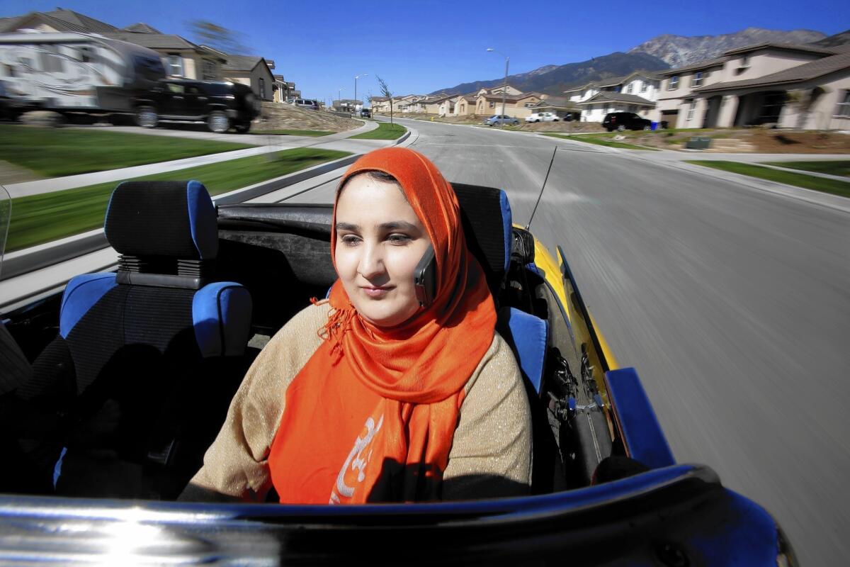 Lena Khan was given a traffic ticket in Glendale for talking on her cellphone, which was tucked into her head scarf, while driving. She's fighting it.