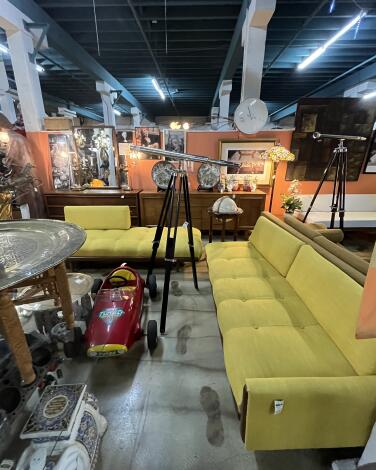 A yellow midcentury sofa inside King Richard's Antique Center in Whittier.