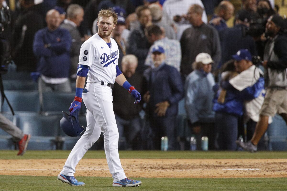 Dodgers' Gavin Lux reacts after his fly ball is held up by a stiff wind and ends Game 3 of the NLDS against the Giants.