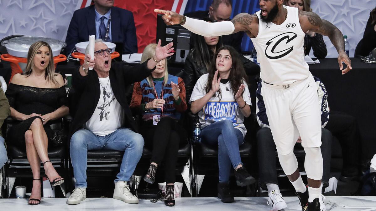 LeBron the brightest star among stars at Lakers home debut