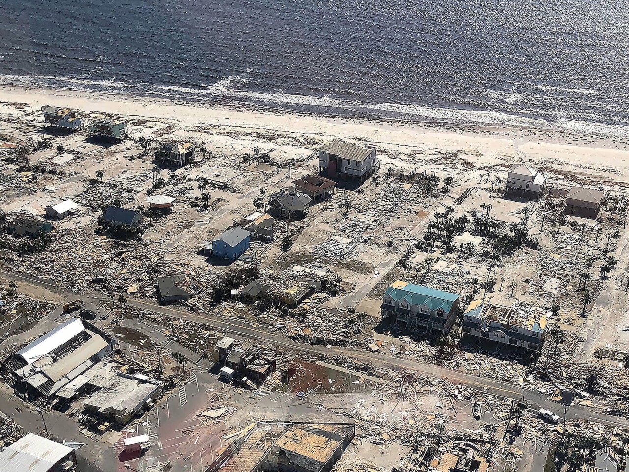 Aerial image of damage to homes and flooding after the arrival of Hurricane Michael in Mexico Beach, Fla.