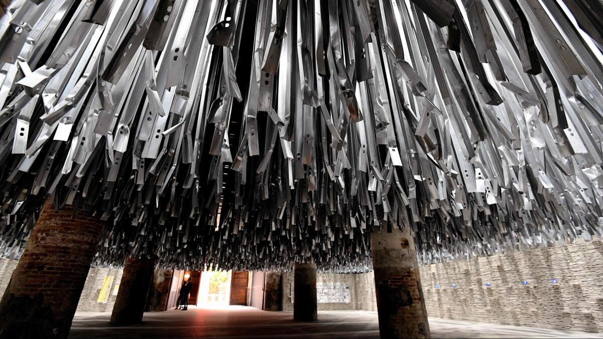 A dramatic installation by Venice Architecture Biennale Director Alejandro Aravena employs the tons of detritus left behind by last year's Venice art biennial.