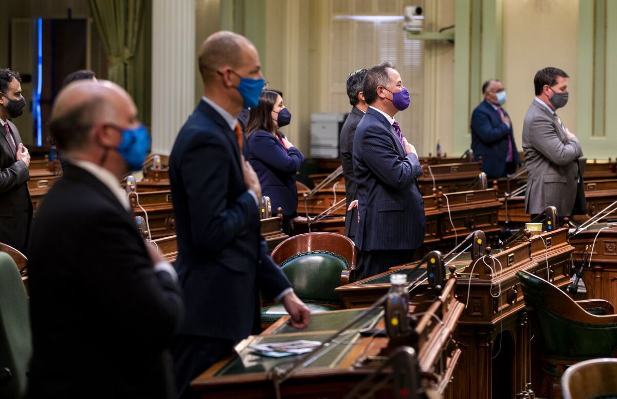 Members of the California State Assembly say the Pledge of Allegiance.