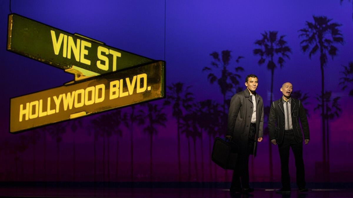 Conrad Ricamora, left, and Francis Jue star in "Soft Power," a David Henry Hwang play with Jeanine Tesori music having its world premiere at the Ahmanson Theatre.