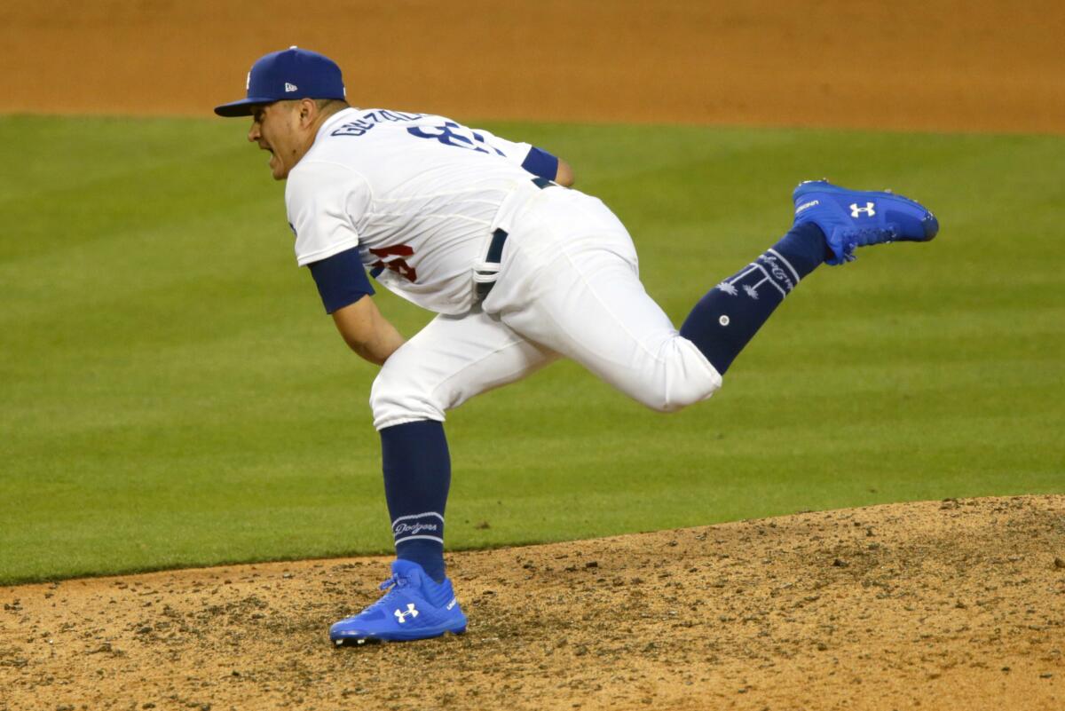 Dodgers starting pitcher Victor González strikes out San Diego's Jurickson Profar.