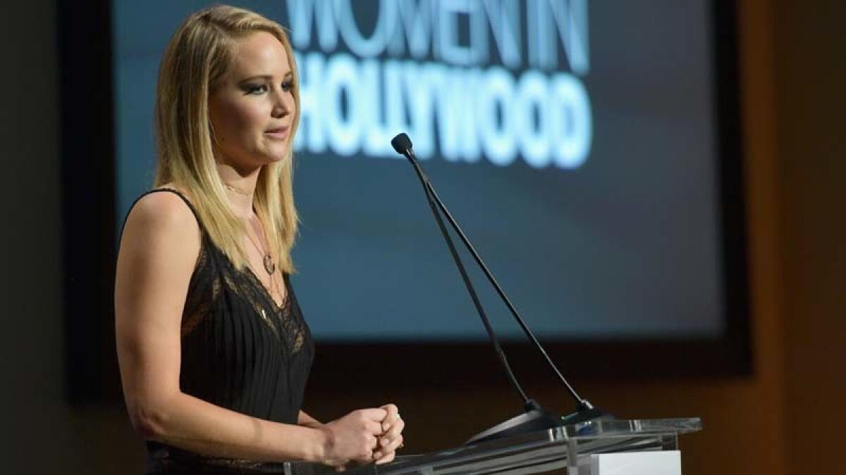 Jennifer Lawrence accepts an award at the 24th Elle Women in Hollywood event on Monday.
