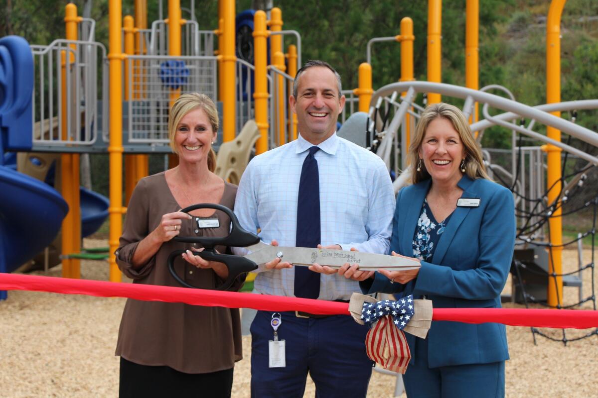 Superintendent Jodee Brentlinger, left, at the opening of Solana Santa Fe's new play structure with Principal Matt Frumovich and SBSD President Julie Union.