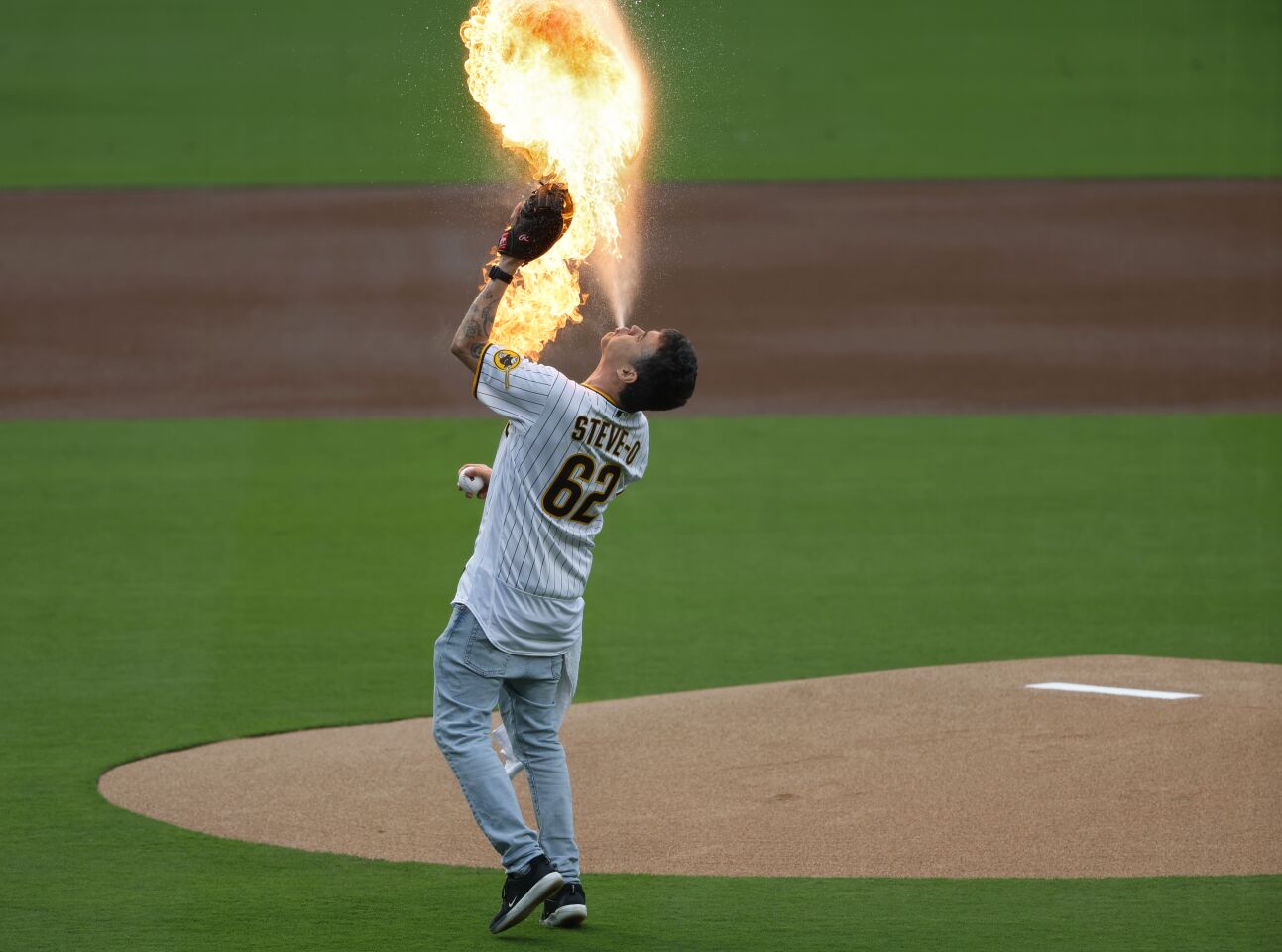 San Diego CA - May 15: Steve-O spits a fireball before throwing out the ceremonial first pitch before the San Diego Padres played the Kansas City Royals at Petco Park on Monday, May 15, 2023. (K.C. Alfred / The San Diego Union-Tribune)s