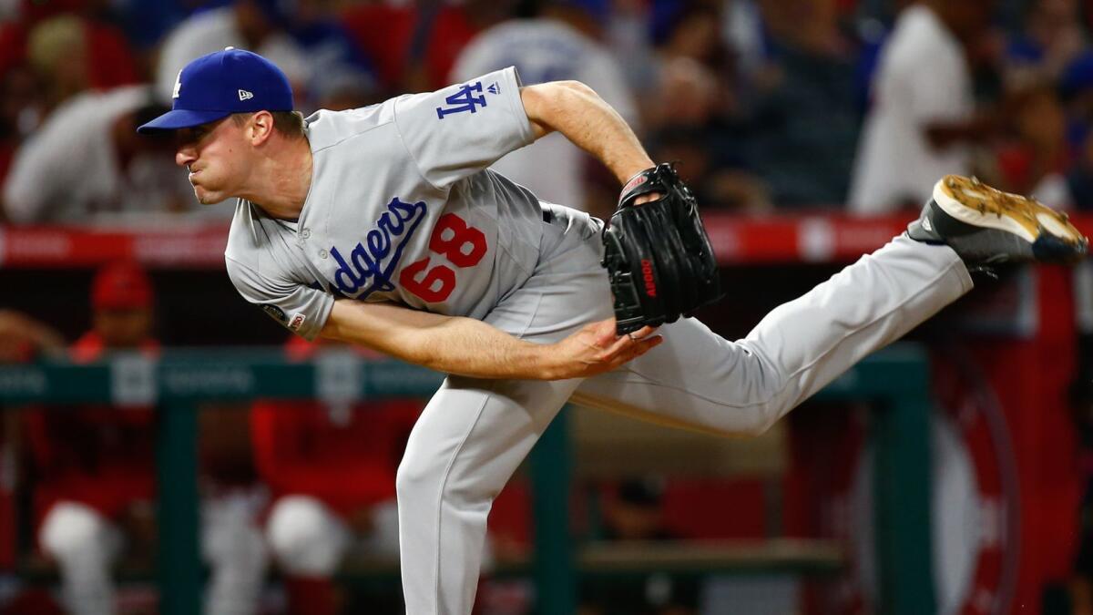 Dodgers reliever Ross Stripling delivers during a game against the Angels on June 10. Strong performances by Dodgers starters has led to fewer in-game pitches for the long reliever.