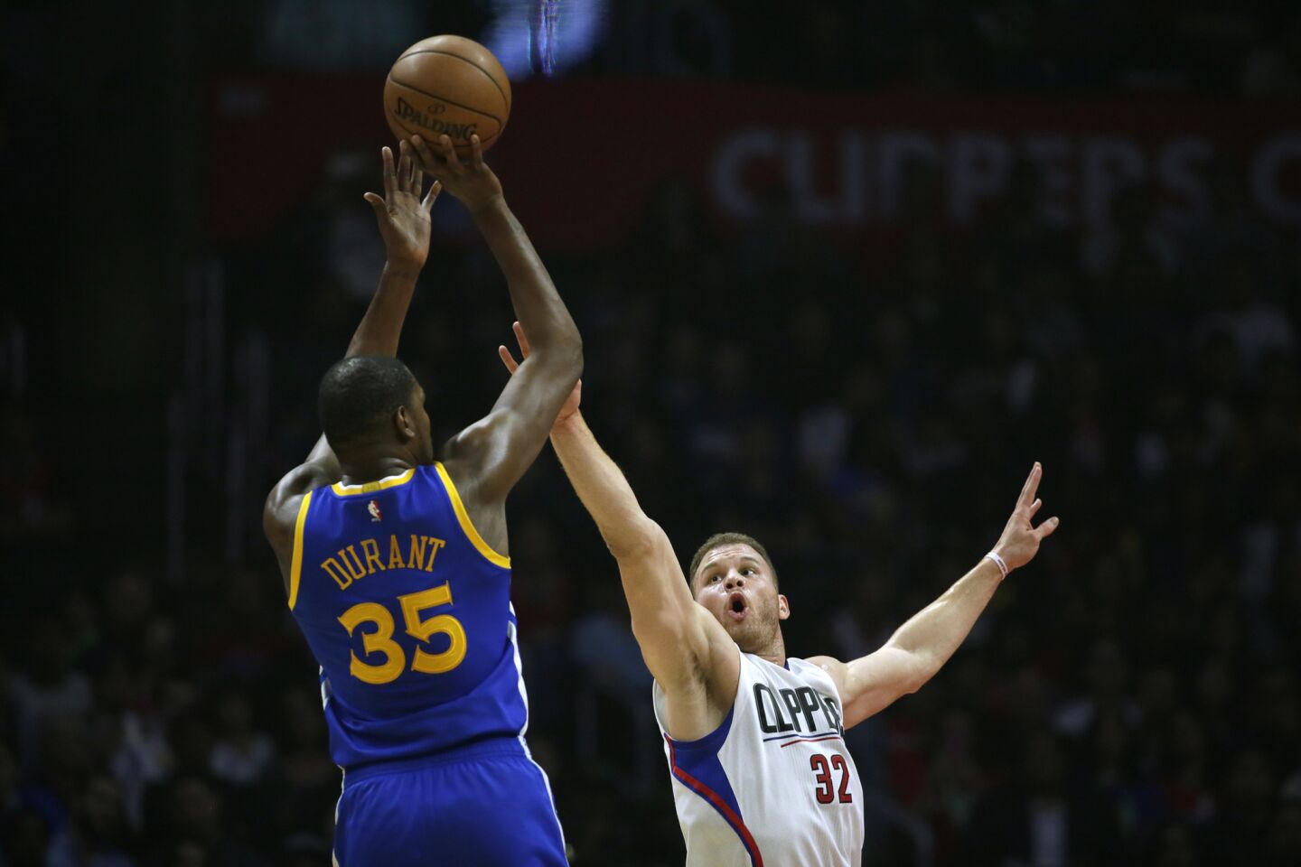 Warriors forward Kevin Durant shoots over Clippers forward Blake Griffin during first-half action.